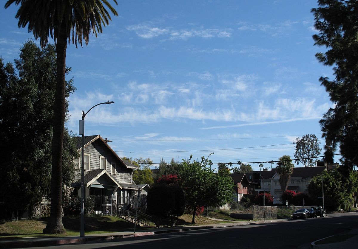 House at 354 S. Harvard Blvd, Los Angeles, with cirrus fibratus clouds