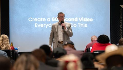 Paul Getter speaking on stage at a Speakpreneur event